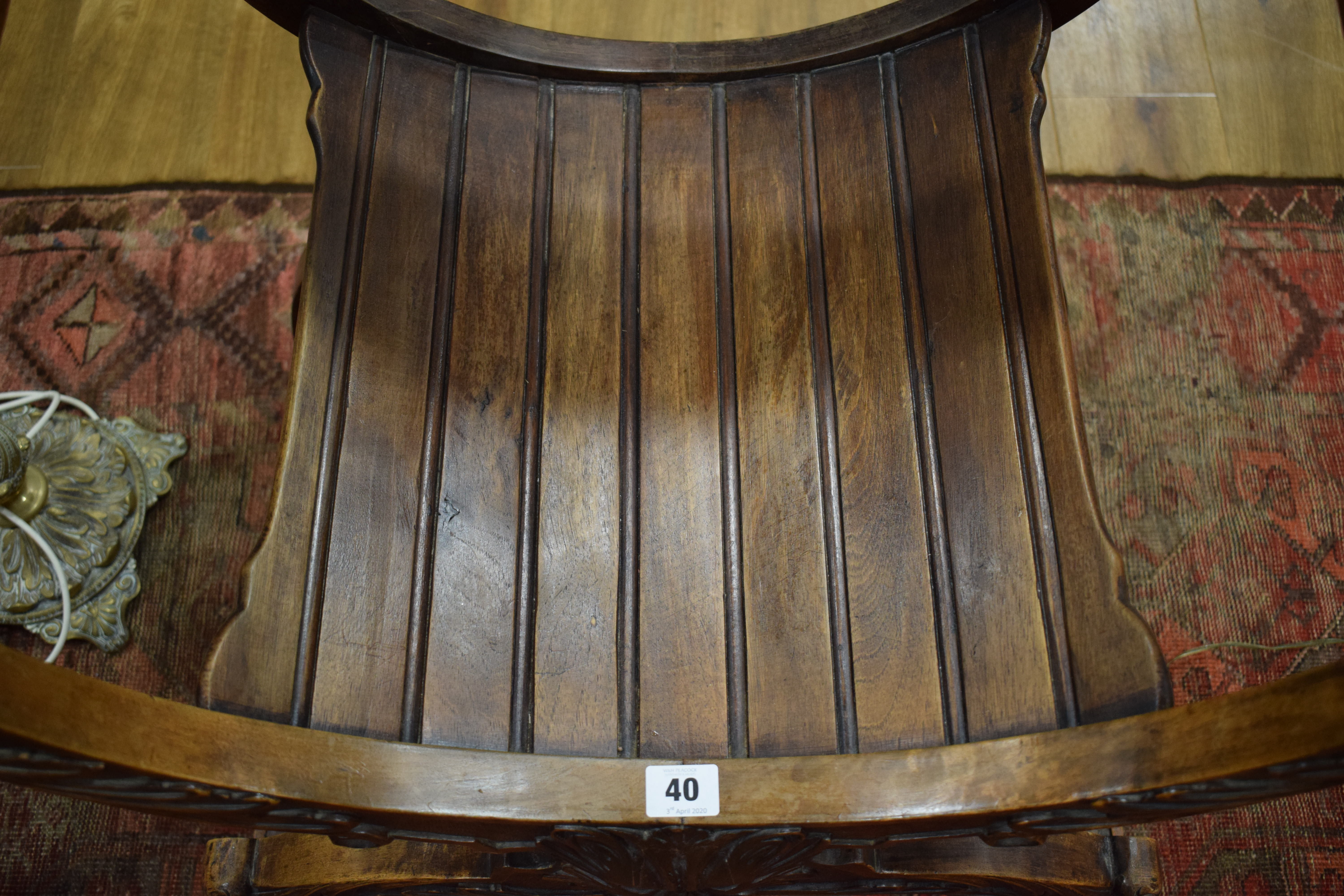 A continental walnut throne-type chair carved with stylised figures and foliate motifs, h. - Image 10 of 12