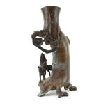 A Chinese brown patinated bronze spill vase modelled as donkey and rider below a blossoming tree, h.