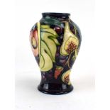 A Moorcroft Queens Choice pattern vase of baluster form, h. 15.