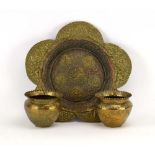 An Eastern brass and copper finished table centre of flower-head form,