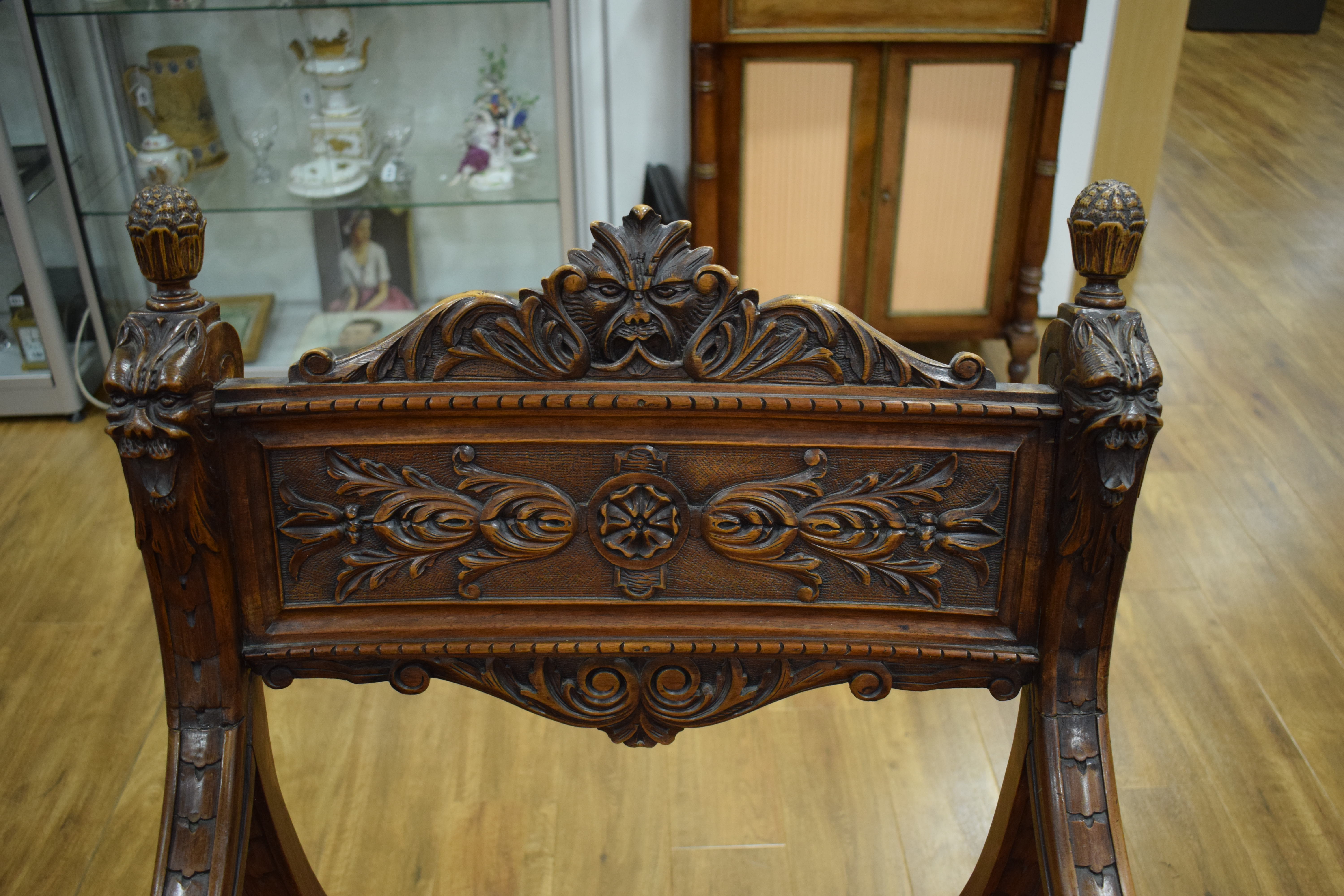 A continental walnut throne-type chair carved with stylised figures and foliate motifs, h. - Image 9 of 12