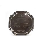 A silver salver of canted square form on four scrolled feet, maker AC& Sons Ltd. Birmingham 1974, d.