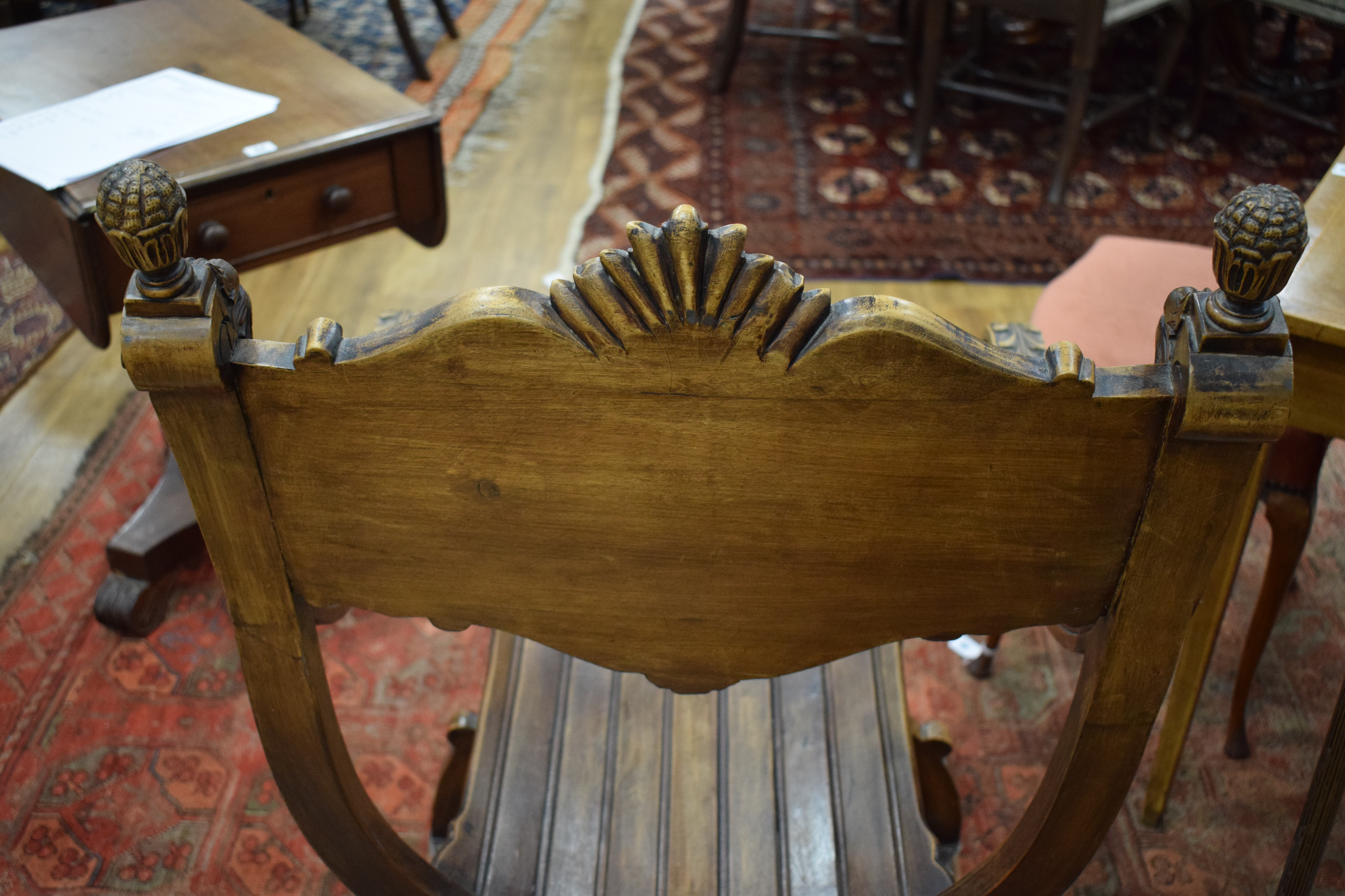 A continental walnut throne-type chair carved with stylised figures and foliate motifs, h. - Image 4 of 12