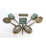 A silver and pale green guilloché enamelled hand mirror and pair of matching hairbrushes,
