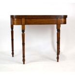 An early 19th century mahogany, strung and crossbanded card table of typical form on turned legs, w.