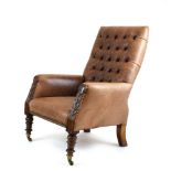 A 19th century walnut framed buttoned pale brown leather library chair with acanthus leaf