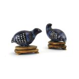 A pair of Chinese cloisonne figures modelled as quails, each decorated in shades of blue,