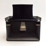 A silk top hat by Harman & Son,