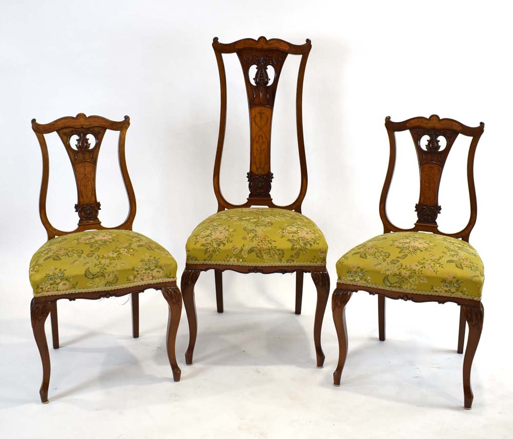 A set of three high and lowback Edwardian parlour chairs with satinwood frames,
