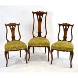 A set of three high and lowback Edwardian parlour chairs with satinwood frames,