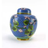 A modern cloisonne ginger jar and cover of typical form decorated with blossoming branches on a