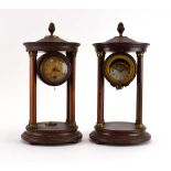 A pair of Neo-Classical mahogany and brass mounted clock cases modelled as pavilions,