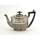 A silver bachelor's teapot of vase shaped form with gadrooned decoration, hallmarks rubbed,