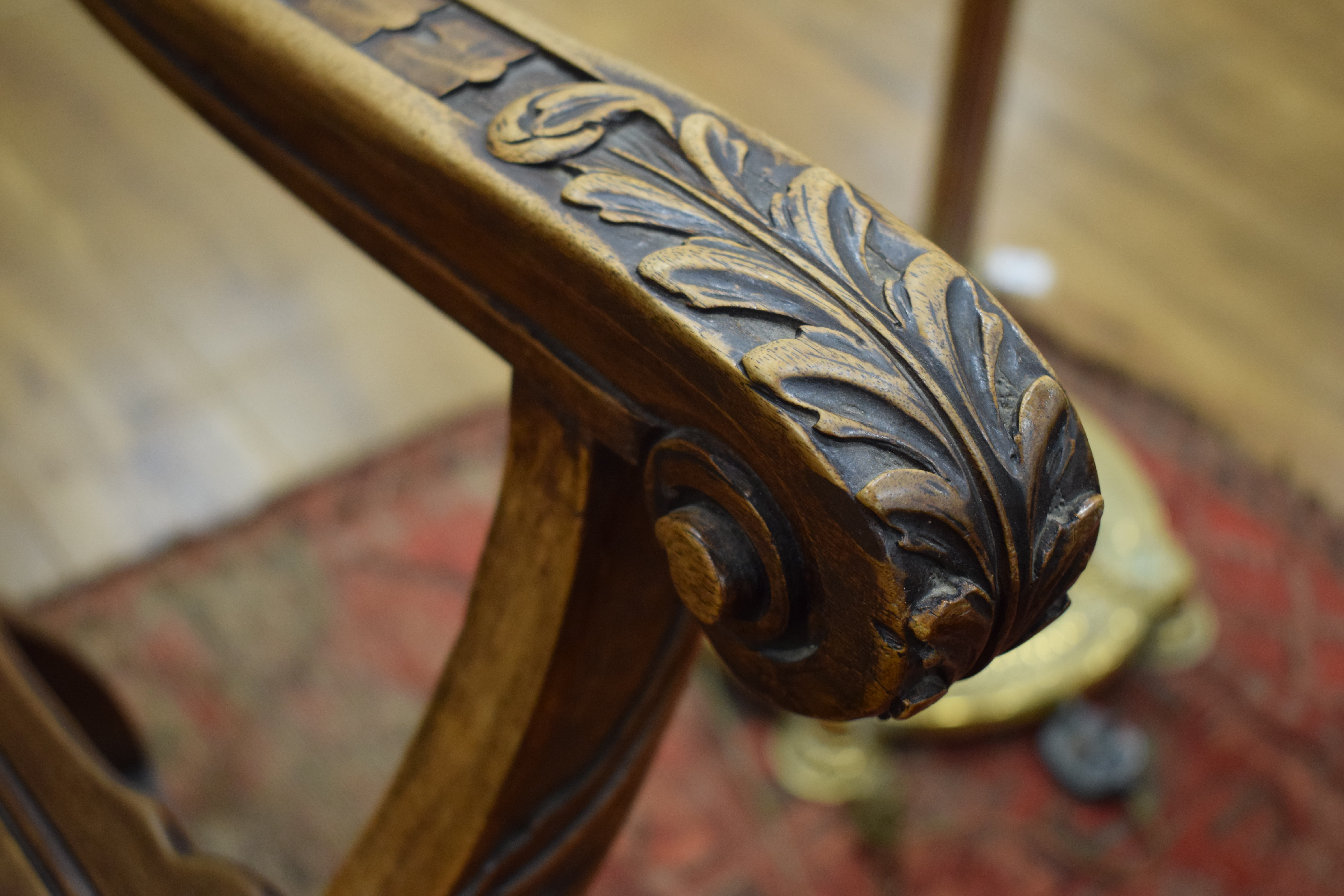 A continental walnut throne-type chair carved with stylised figures and foliate motifs, h. - Image 7 of 12