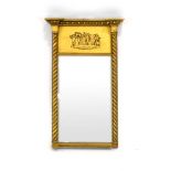 A Regency-style gilt pier mirror of rectangular form decorated with putti within barley twist