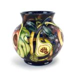 A Moorcroft Queens Choice pattern vase of globular form, h.