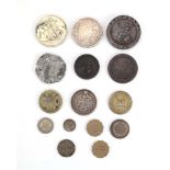 A group of coins including a 1666 Charles II silver crown, 1797 'cartwheel' twopence,