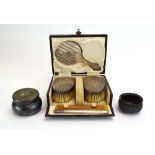 A cased miniature silver four piece dressing table set, maker FGR, Birmingham 1927, mirror l.