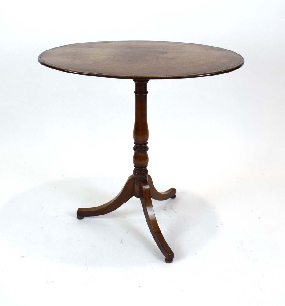 A 19th century mahogany tripod wine table with oval surface on a fixed base, w. 71.