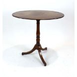 A 19th century mahogany tripod wine table with oval surface on a fixed base, w. 71.