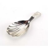 A Georgian silver old English pattern caddy spoon with shell bowl and wrigglework handle,