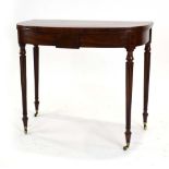 A Victorian mahogany and ebony inlaid tea table of typical form on reeded legs, w.