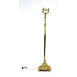 A late 19th/early 20th century brass standard lamp of columnar form, converted to electricity, h.