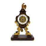 A French Empire mantle clock, the twin-train movement striking on a gong,