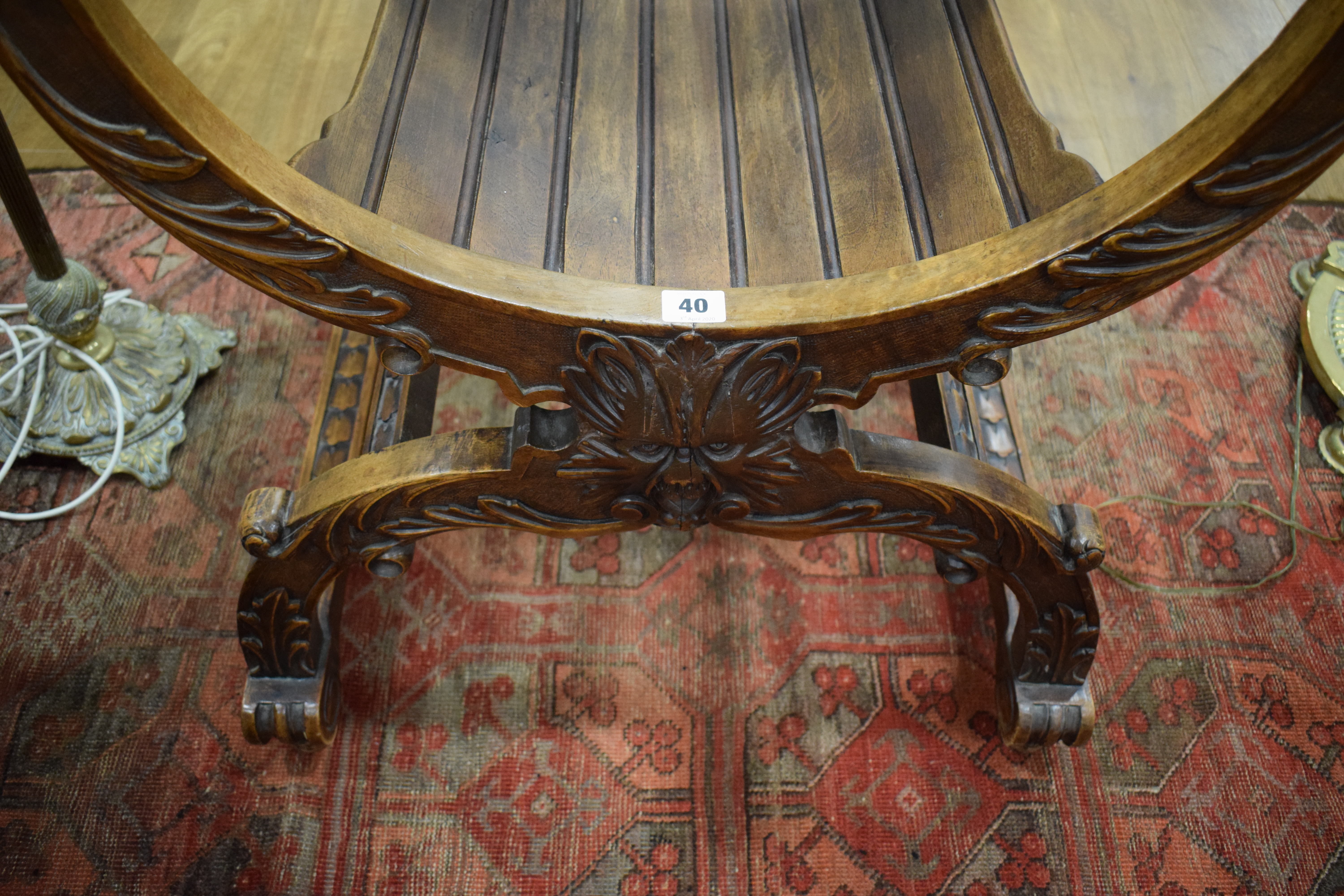 A continental walnut throne-type chair carved with stylised figures and foliate motifs, h. - Image 6 of 12