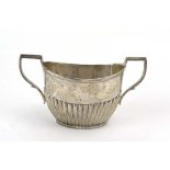 An Edwardian silver two handled sugar bowl with gadrooned decoration, maker JR, Sheffield 1905,