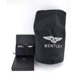 Andrew Frankel: 'Bentley: The Story', within a hard case, together with a Bentley First Aid kit,