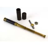 An early 20th century brass and leather clad four-drawer telescope,