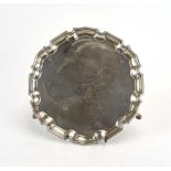 A small Edwardian silver salver of circular form on three hoof feet, maker CSH, London 1903, d.