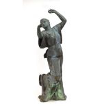 A 1920/30's green-patinated bronze figure modelled as a dancing lady wearing a flowing dress and