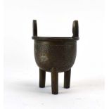 A Chinese brown patinated bronze two handled censer of typical form,
