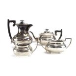 A matched four piece silver tea service of typical vase form, various dates and makers,