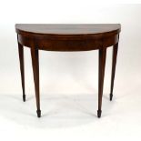 An early 19th century mahogany and strung card table of typical form on tapered legs, w. 91.