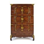 A Korean elm and brass mounted cabinet having four small drawers above three pairs of doors on