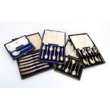 Three cased sets of six silver teaspoons,