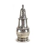 A silver sugar dredger of globular form with gadrooned decoration, makers marks indistinct,