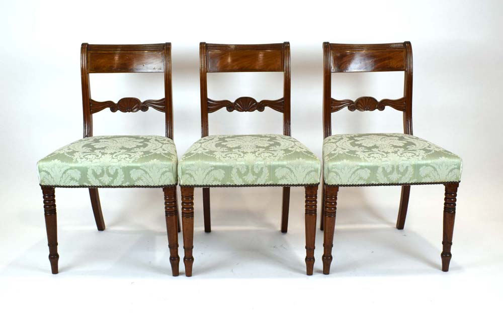 A set of six Victorian mahogany and brass inlaid bar back dining chairs with shell design