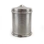 A silver, engine turned and parcel gilt cigarette box and cover of cylindrical form,
