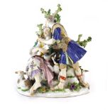 A Meissen figural group modelled as a gentleman in Roman costume presenting a spray of flowers to