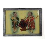 A late 19th/early 20th century Chinese reverse painting on glass depicting three children at play,