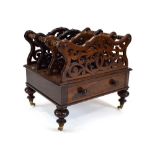 A Victorian rosewood four section Canterbury of typical form having a single drawer above four