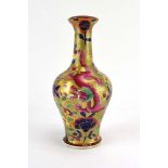 A Chinese vase of baluster form gilt decorated with dragons amongst blossoming shrubs,