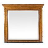 A continental walnut framed wall mirror of imposing proportions,