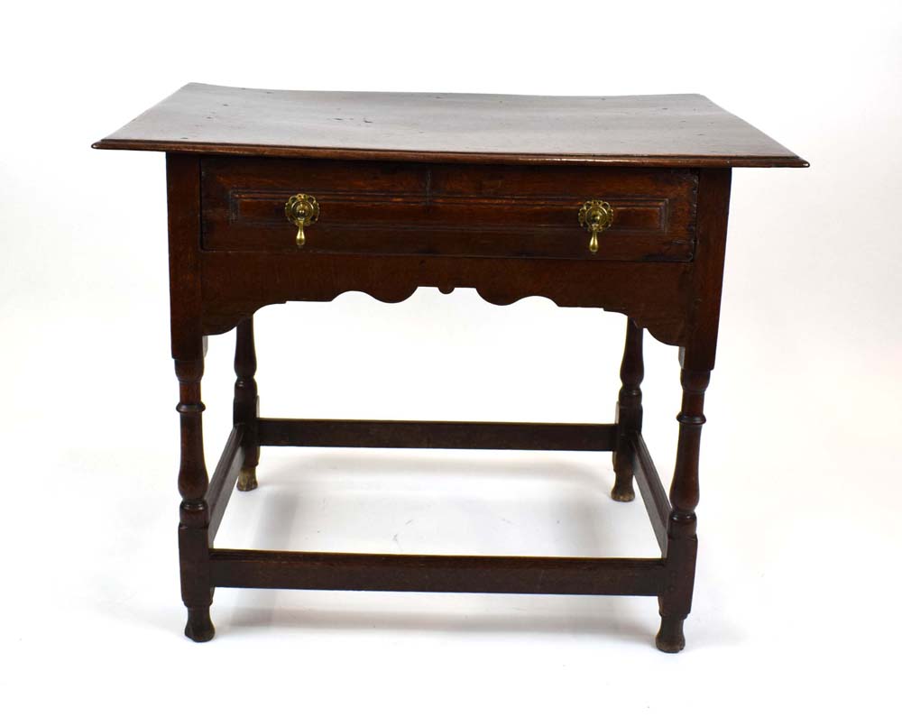 A 17th century oak side table having a single frieze drawer above rectangular stretchers, w.