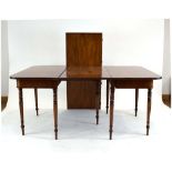 A late 18th/early 19th century mahogany extending dining table having a pair of d-end sections and
