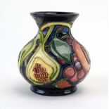 A miniature Moorcroft Queens Choice pattern vase of globular form, h.